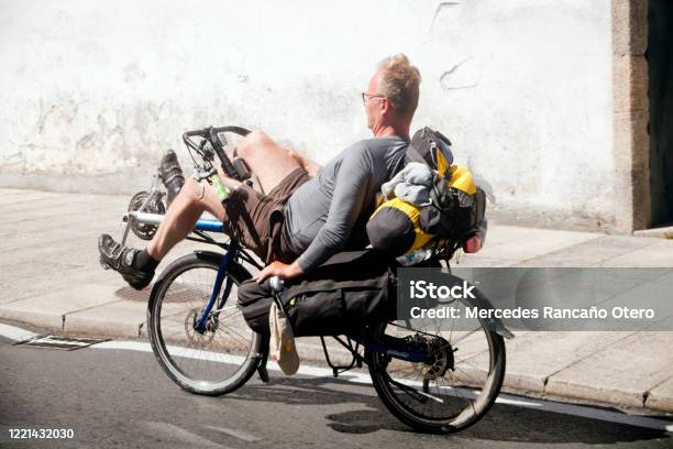 Pilgrim Cyclist Riding A Recumbent Bike In Old Town Santiago De Compostela Stock Photo - Download Image Now