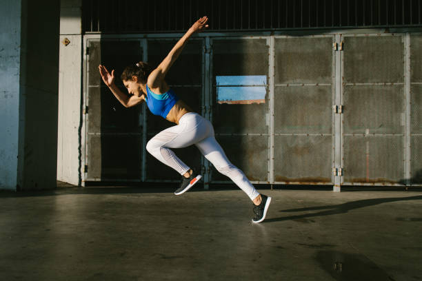 istock Sporty young woman on running sprint training 1221432869