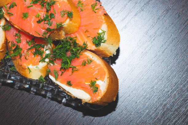 Smoked salmon sandwich. red fish appetizer. festive dinner