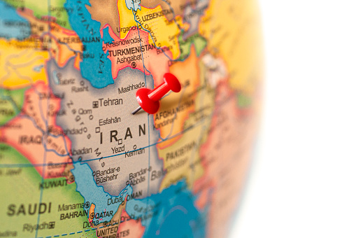 Iran map. Earth globe close up with a red pin in Iran.