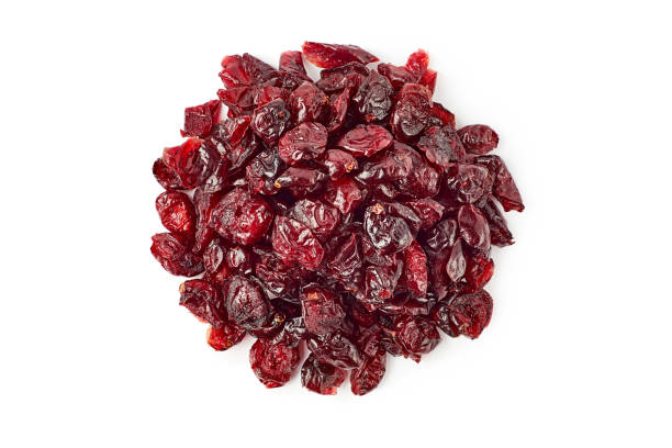 heap of dried cranberries on white - shiny group of objects high angle view close up imagens e fotografias de stock