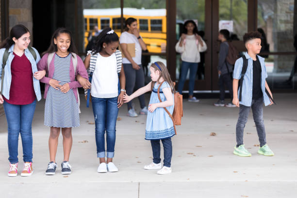istock Schoolgirls walk together after school 1221435824