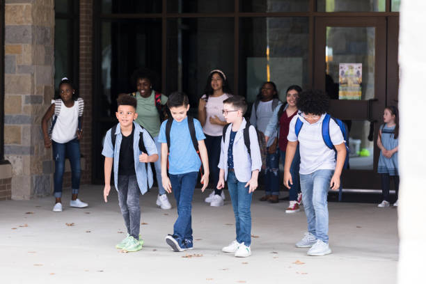 istock Schooboys leaving school together 1221435931