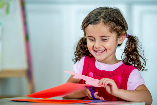istock Cute little girl learning at home. 1221437407