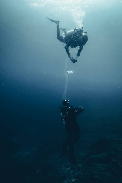 istock Scuba divers takes underwater photo 1221440474