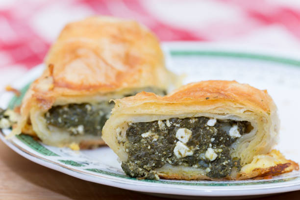 Homemade pie with spinach on a plate stock photo