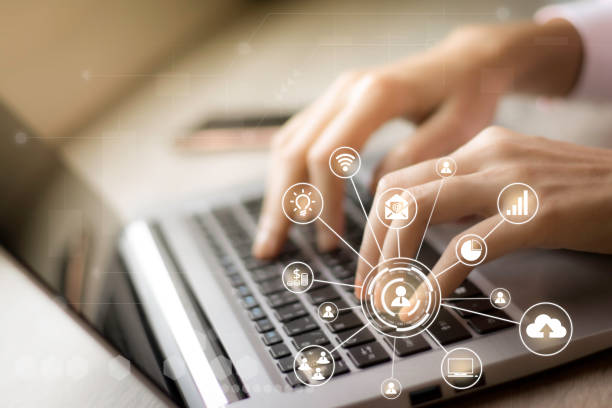 istock Internet of things Futuristic ai technology with virtual icons interface concept, cloud, social media and big data on blurred business woman working with laptop computer at home background. Social distancing 1221442210