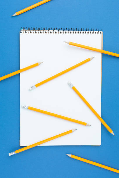 istock Album for drawing on a blue isolated background. 1221445654