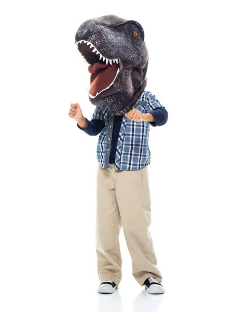 istock Boys standing in front of white background wearing mask - disguise 1221445949
