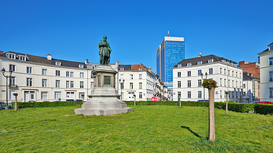 Brussels, Belgium - April 26, 2020:  Barricades square and the statue of Vesale at Brussels without any people during the confinement period.