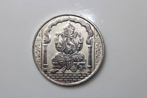 A ganesha silver coin on white background color.