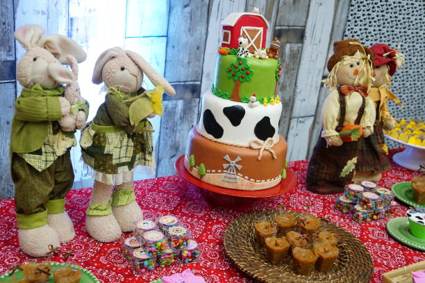 istock Child's birthday. Farm theme. Cake table with sweets and decoration 1221447933