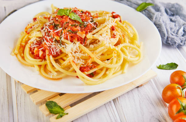 istock Tasty appetizing classic Italian spaghetti pasta with tomato sauce 1221448103