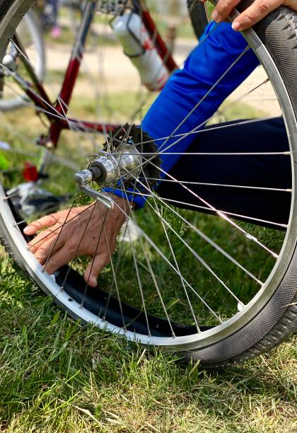 istock Man repairing flat tire 1221448445