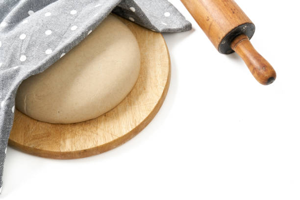 istock Raw dough for sourdough rye bread, rolling pin 1221448500