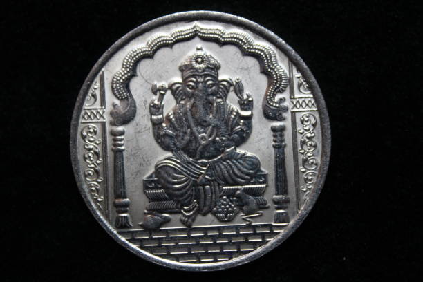 istock Lord Ganesha on silver coin with black background 1221449539