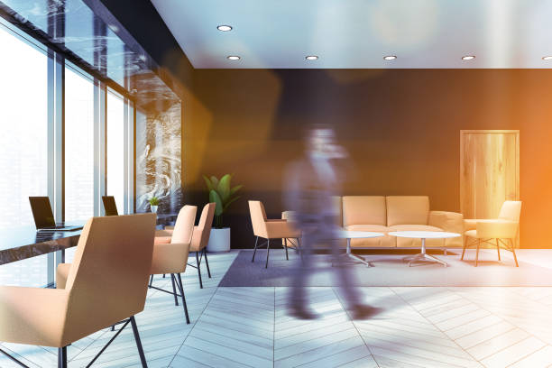 istock Businessman walking in gray office waiting room 1221450238