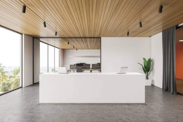 istock Reception desk in white and orange office 1221451519