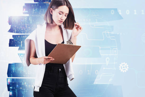 istock Woman with clipboard in city, network interface 1221452033