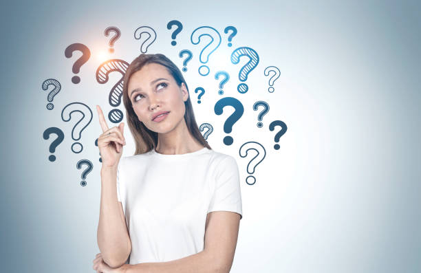 istock Pensive college girl, question marks 1221452806