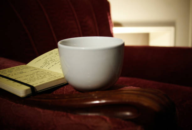 istock Relaxing coffee and book in quite arm chair 1221453033
