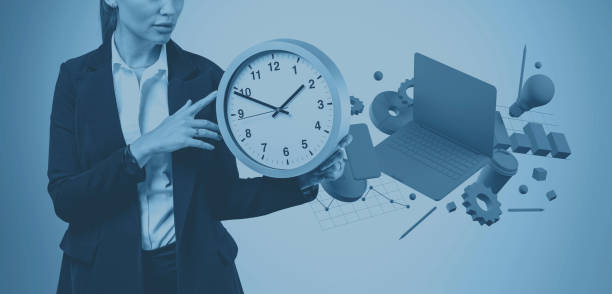 istock Unrecognizable businesswoman with big clock 1221453187