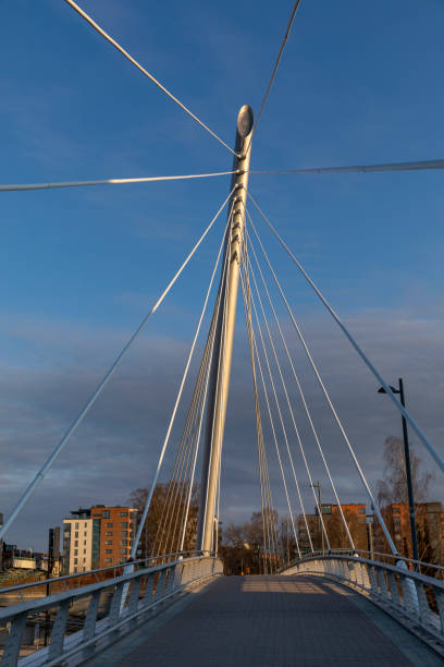 istock Urban pedestrian bridge in Finnish spring sunshine 1221453657