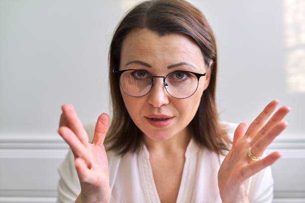 istock Female mentor, tutor, teacher looking at webcam, closeup face 1221454785