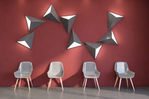 istock Four chairs in simple red waiting room 1221454929