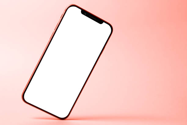 istock Smartphone mockup, phone with blank screen and shadow isolated on red background. Modern technologies social networks and applications. Symbol of lightness freshness airiness. Copy space 1221455125
