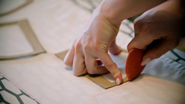 istock Young woman seamstress making marks using the soap and form indoors 1221455734