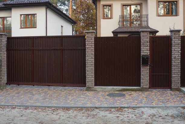 istock closed private brown metal gate 1221457327