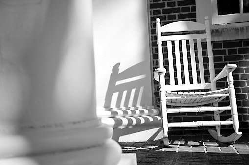 Rocking chair on dramatic front porch