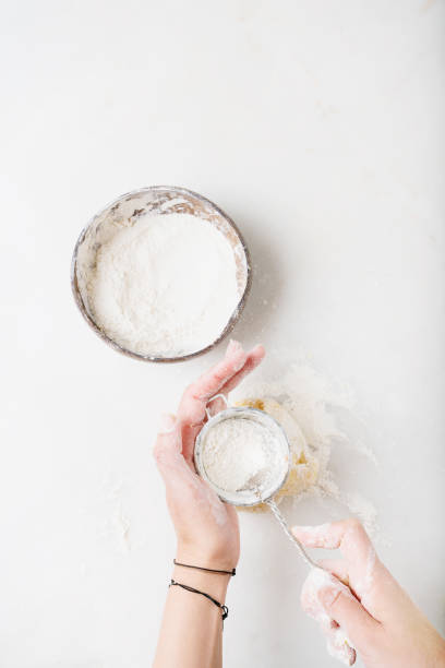istock Dough Making Process. Female hands kneading the dough. 1221458289