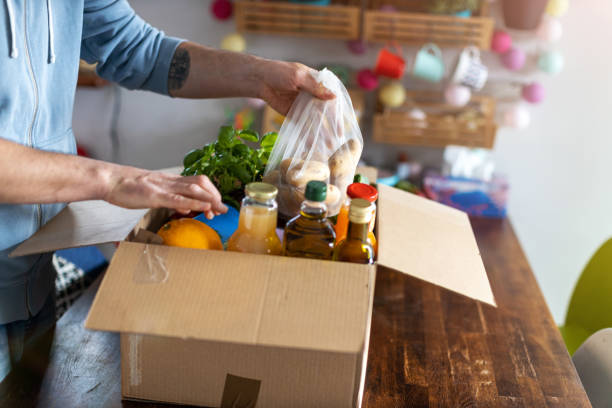 istock Man checking his fresh food delivery 1221458658