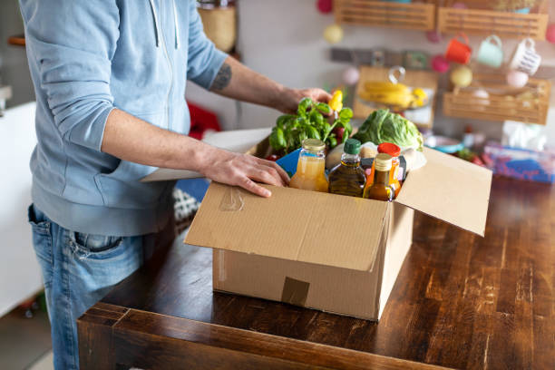istock Man checking his fresh food delivery 1221458865