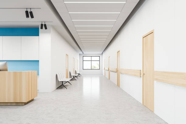 istock Hospital corridor with chairs and reception 1221459066