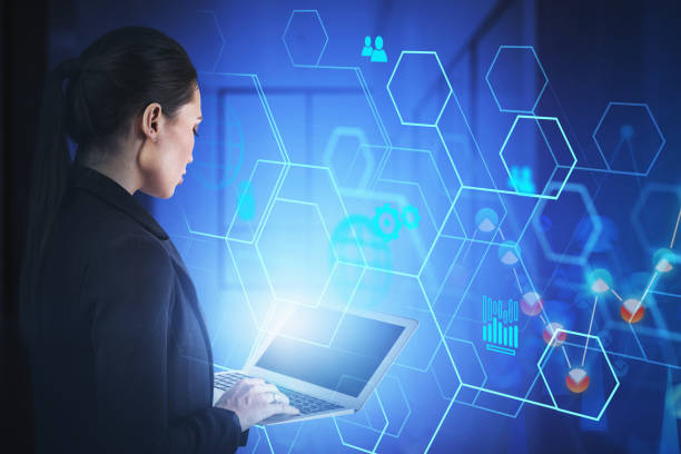 istock Woman with laptop in office, business interface 1221460442