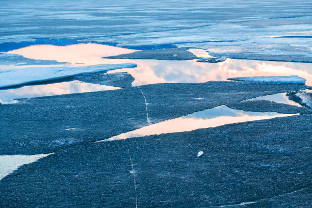 istock Melting ice on the lake at sunset. 1221460571