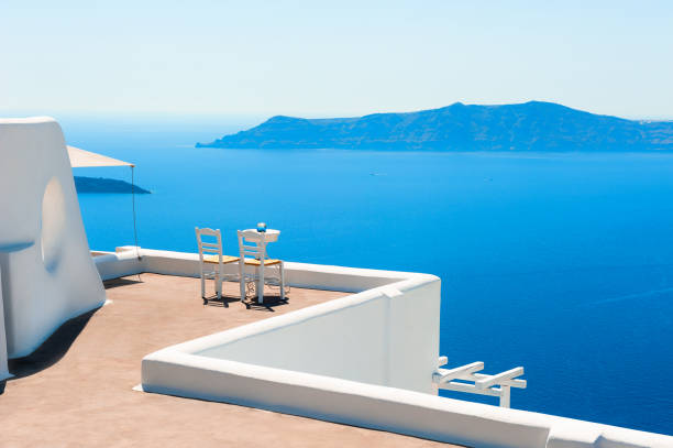 istock Two chairs on the terrace with sea view. 1221460663