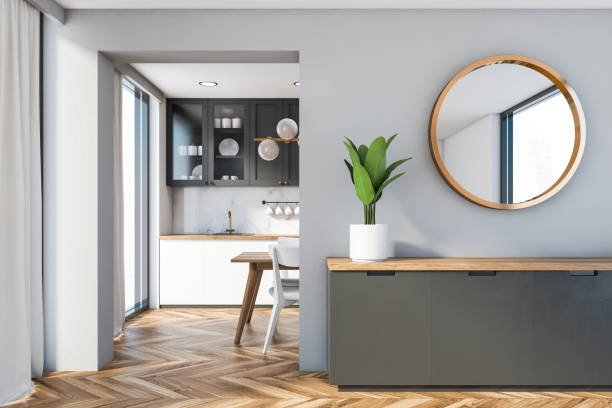 istock Cabinet and mirror in gray dining room 1221462028