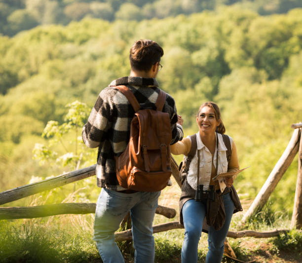 istock Smiling woman and man in the forest 1221464034