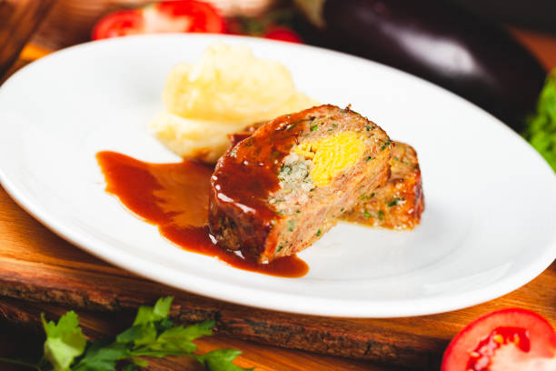 istock Zrazy cutlets with minced meat, rice and eggs served with mashed potatoes on white plate. 1221465024