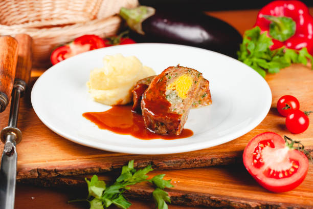 istock Zrazy cutlets with minced meat, rice and eggs served with mashed potatoes on white plate. 1221465105