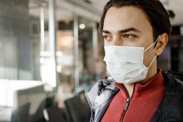 Photo of Man with medecine protective mask in Mall