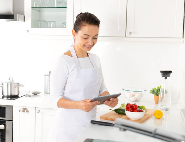 istock Caucasian Woman Using Digital Tablet for Recipe 1221469061