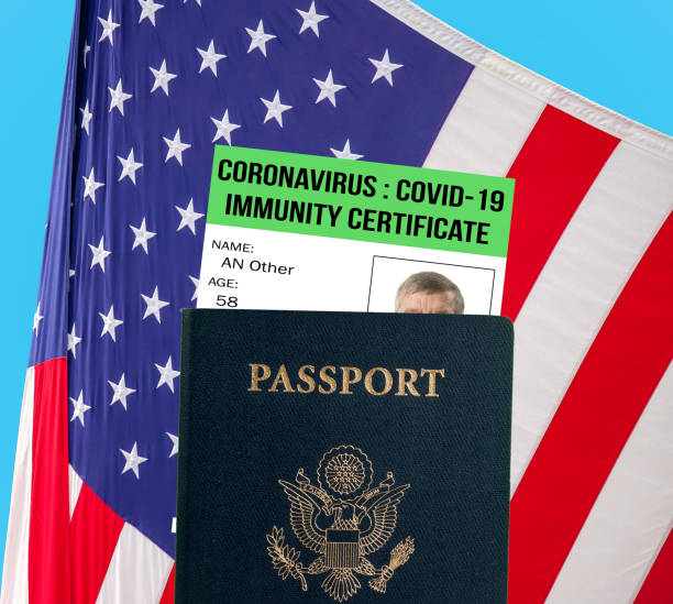 istock US passport with virus immunity certificate against USA flag 1221469854