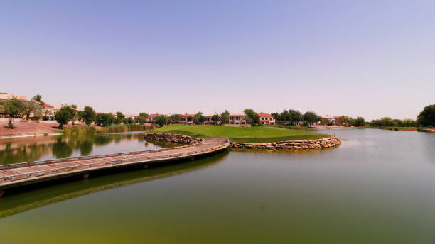istock beautiful golf course surround with lake in a sunny day 1221472660