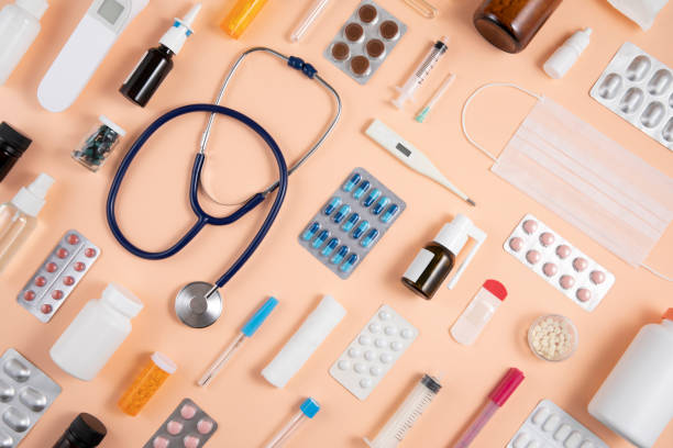 Still Life Knolling with Medical Supplies Medical supplies on coral colored background knolling concept stock pictures, royalty-free photos & images