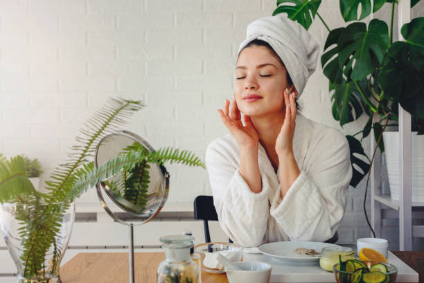 istock Young woman cleaning face with natural cosmetics 1221475279